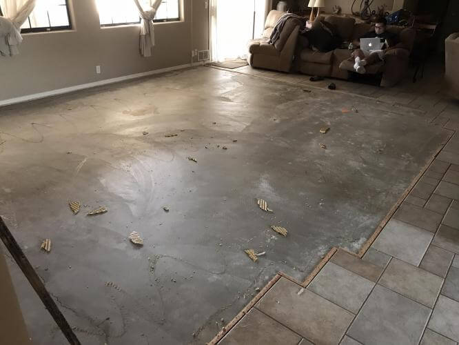 Bare concrete floor before carpet installation